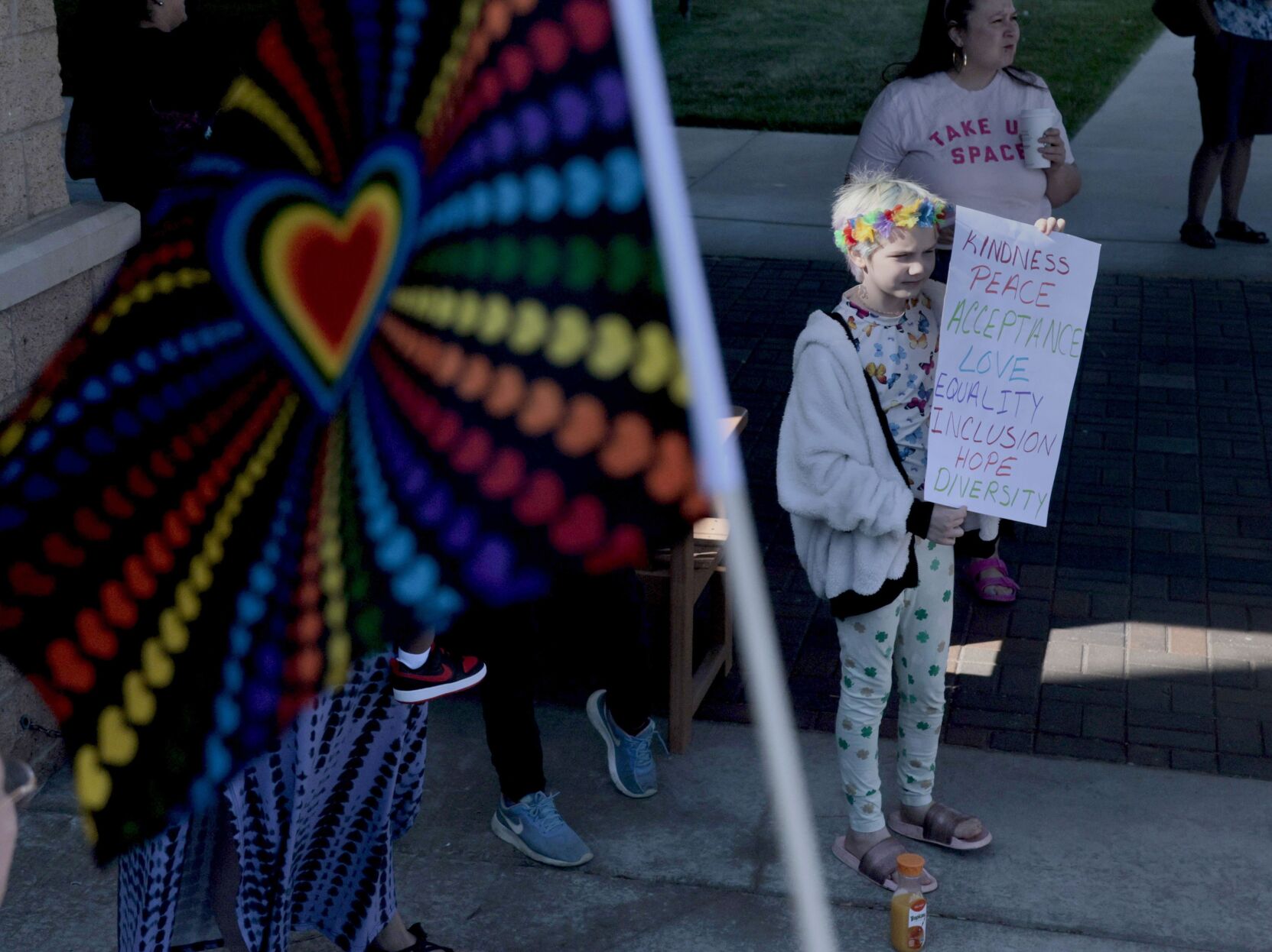 Protesters outside St. Charles county library oppose, support worker wearing goatee and makeup